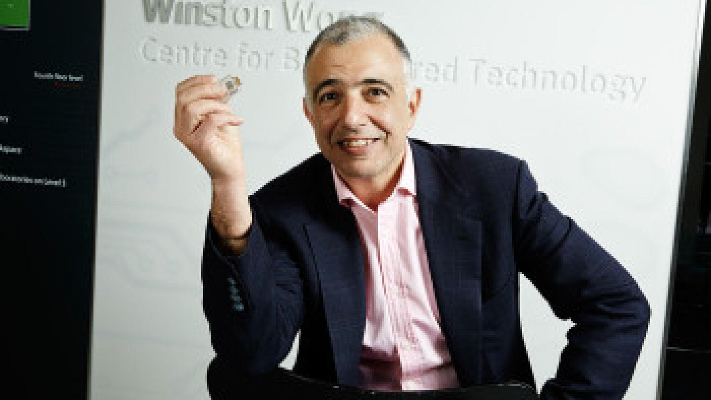 Imperial College London Professor Christofer Toumazou with his Genealysis chip, which can analyze DNA within 30 minutes and without a laboratory. The chip is powered by a mechanism that uses biology input from DNA to run analysis. The patented mechanism is now nominated for a 2014 European Patent Office Inventor Award.