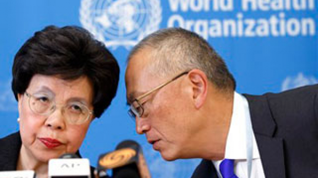 Director General of the World Health Organization, WHO, China's Margaret Chan and Assistant Director General for Health Security Keiji Fukuda of the US, right, share a word during a press conference after an emergency meeting at the headquarters of the WHO in Geneva, Switzerland, Friday, Aug. 8, 2014. (AP Photo/Keystone, Salvatore Di Nolfi)