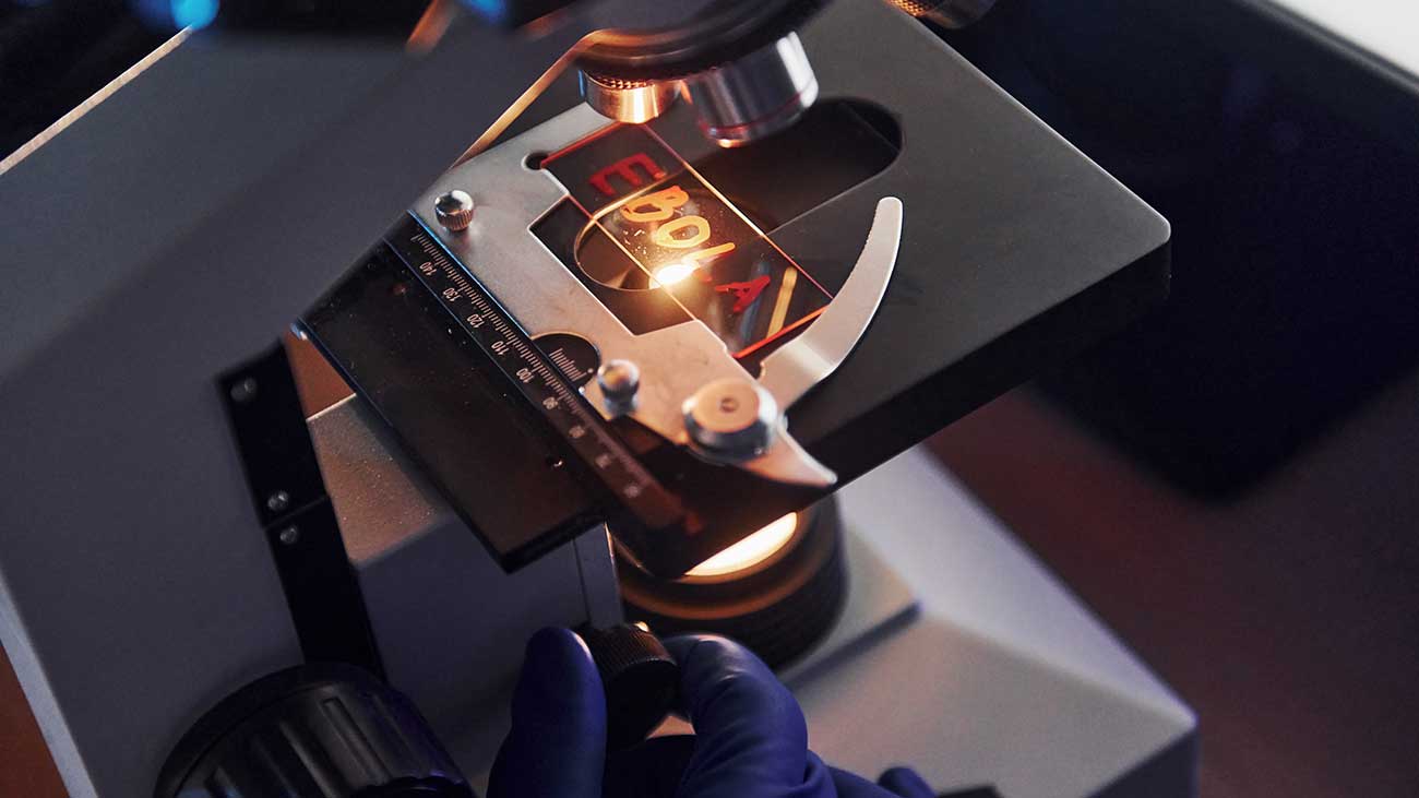Ebola Laboratory Photo | Medical Scientists at Work With Microscope