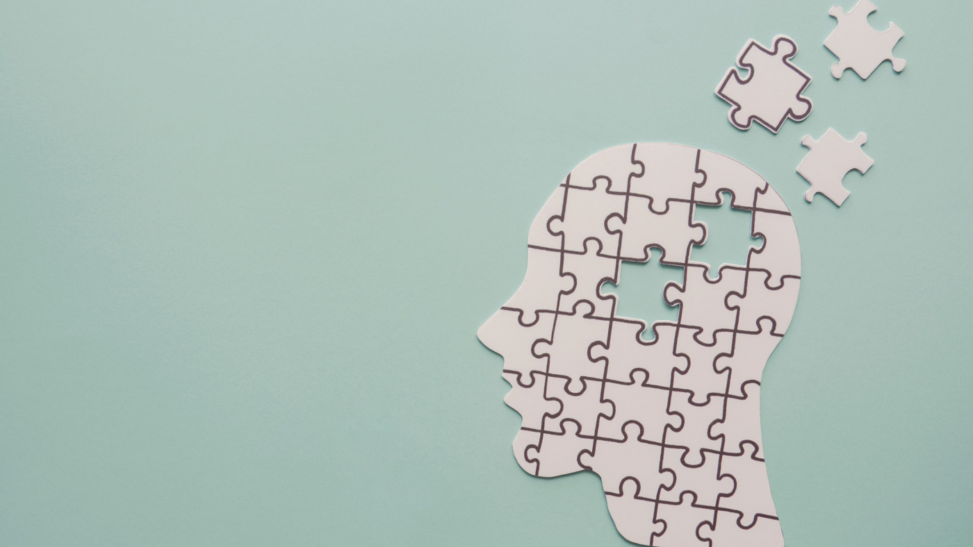 brain with puzzle paper cutout, autism, memory loss, dementia and alzheimer awareness, world mental health day concept