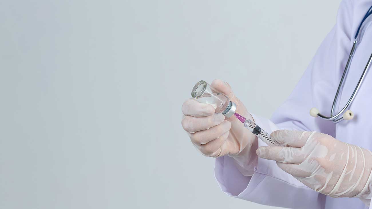 Syringe for Vaccine Injection | Doctor Holding Shot
