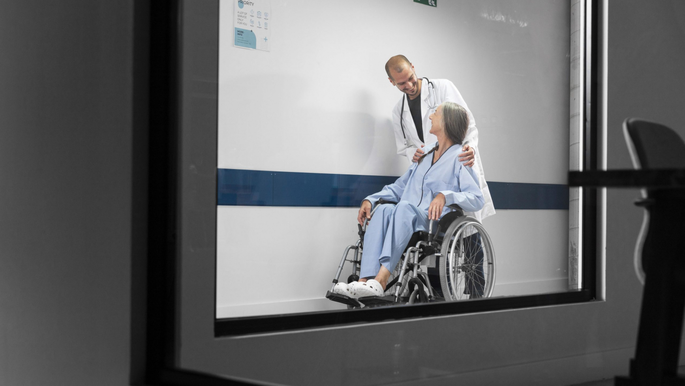 full-shot-doctor-patient-wheelchair