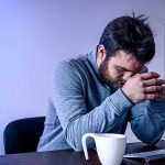 Anxiety Setsin After Coffee Photo of Man at Computer