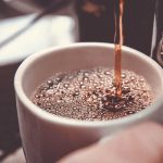 Fresh Coffee Being Poured into Cup Article Abotu Caffeine Effects
