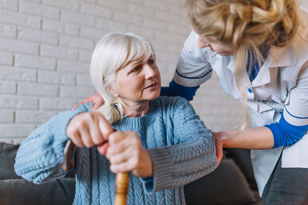 Nurse Helps Patient with Alzheimer's Disease