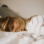 Insomnia and Depression Relationship Types and Causes Photo of Woman Lying Down