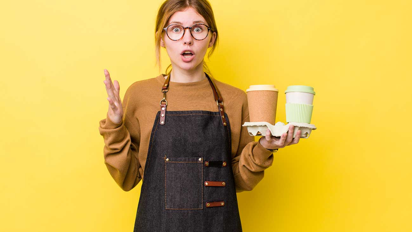 Woman Surprise Holding 2 Cups of Coffee