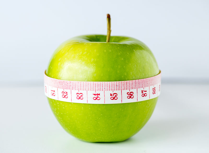 Diet and Weight Loss Illustration Apple with Ruler Around t