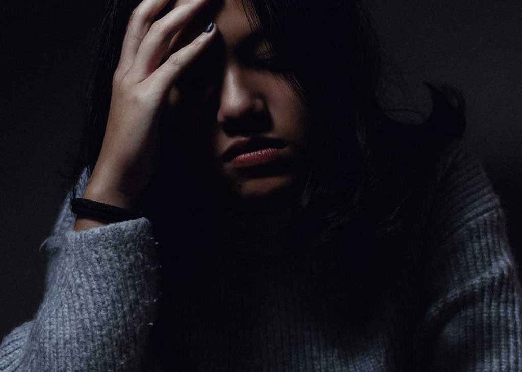 Girl Depressed Holds Head Cannot Motivate to Get Thru the Day