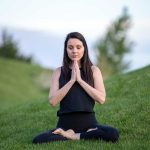Meditation Photo of Woman Meditating in Field