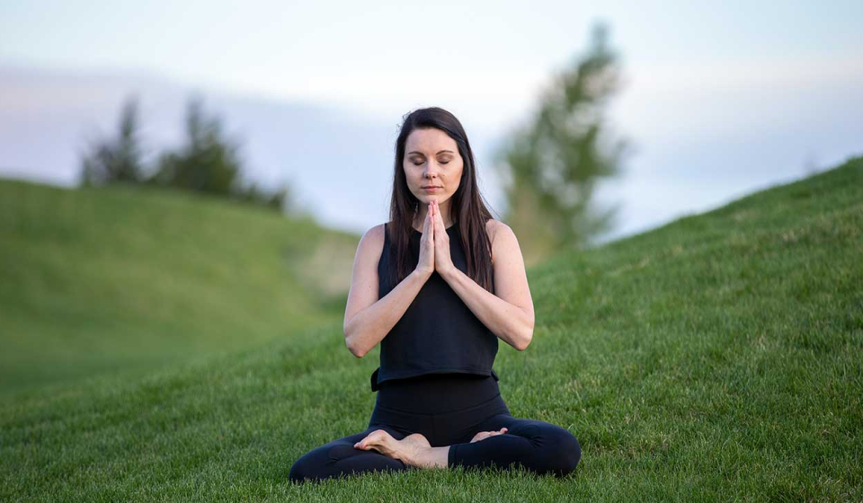 Meditation Photo of Woman Meditating in Field