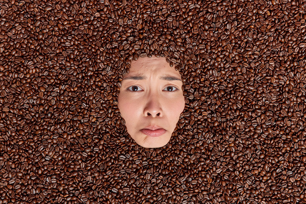 Humorous Caffeine Illustration Man Surrounded by Beans