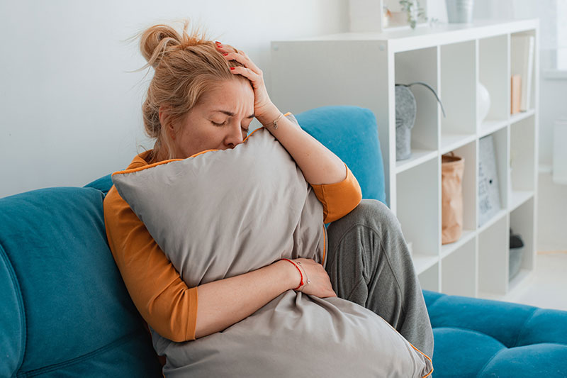 Panic Attack and Anxiety - Woman Stressed on Couch