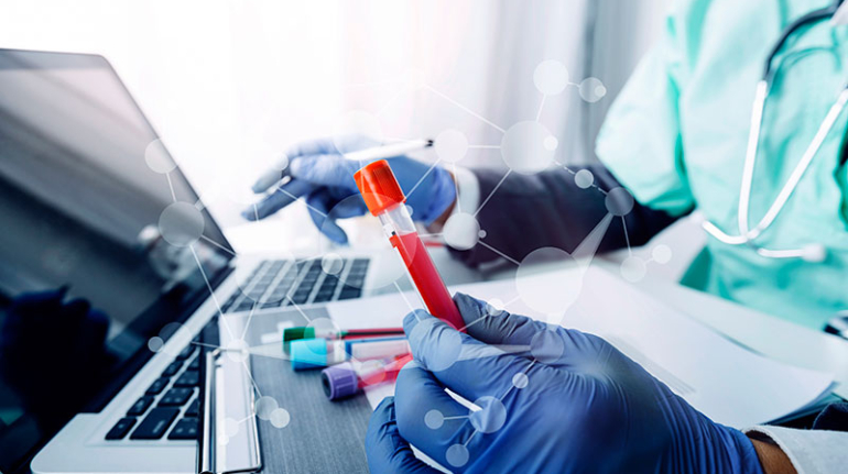 Clinical Trials Doctor Holds Test Tube While Taking Reading